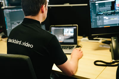 man editing video with blackbird software