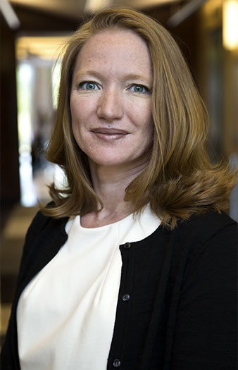 photo of Claire Rutkowski smiling in business suit