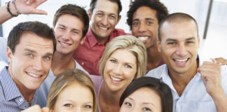 How The Executive Team Can Help Transform Company Culture A group of happy employees showing a good company culture