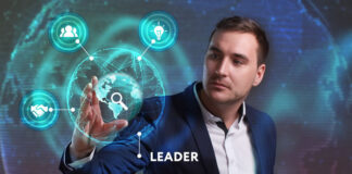 Traits That Make A Great Digital Leader A man in front of a digital image demonstrating a great digital leader