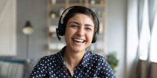 5 Sectors Empowered by Live-streaming During COVID-19 women with headphones live-streaming and laughing