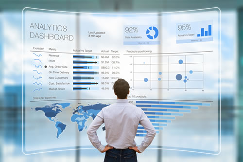 man standing in front of a hologram digital analytical dashboard