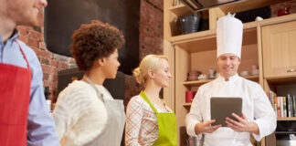 Consumer-centric Design Innovates the Future of Smart Tech 4 chefs in kitchen monitoring their culinary with technology