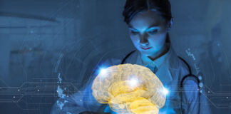 physician holding tablet with a hologram of a digital brain floating