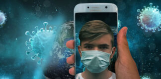 Technology Beats Uncertainty Around Back-to-Work Strategies man holding cellphone with his reflection wearing mask in the phone