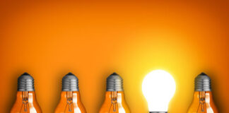 How CEO Pivoted His Tech Startup to Success During the Pandemic 4 upside down dim light bulbs with one right-side up that is bright