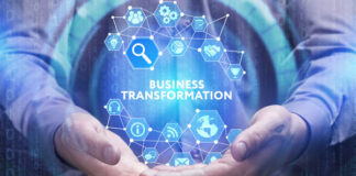 Business Process Transformation Instead of Business Process Improvement man clasping hands together and holding a hologram globe that shows business transformation
