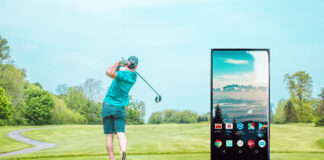 golfer swing on a golf course with a smart phone showing a smart app