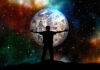 How InvoZone is Helping the World silhouette of man holding digital world with starry solar system in background