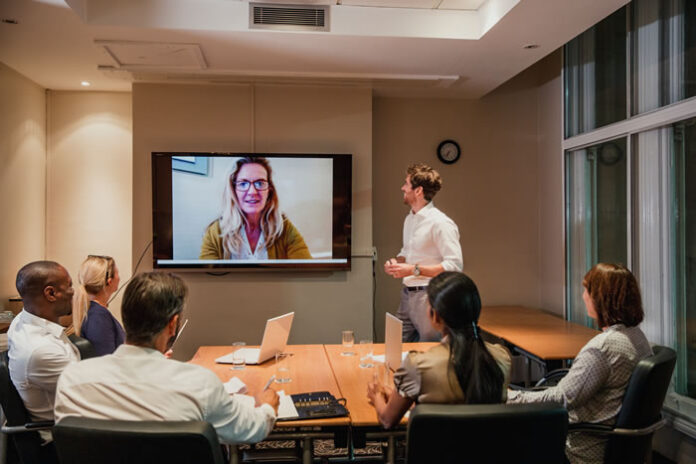 business meeting in conference room on a video conference call
