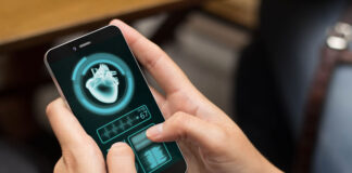 How to Optimize Your Healthcare Practice with Technology Solutions women holding phone while looking at healthn