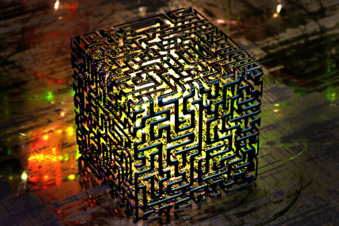 a cube with a maze design that is lit up from the inside representing a quantum cube