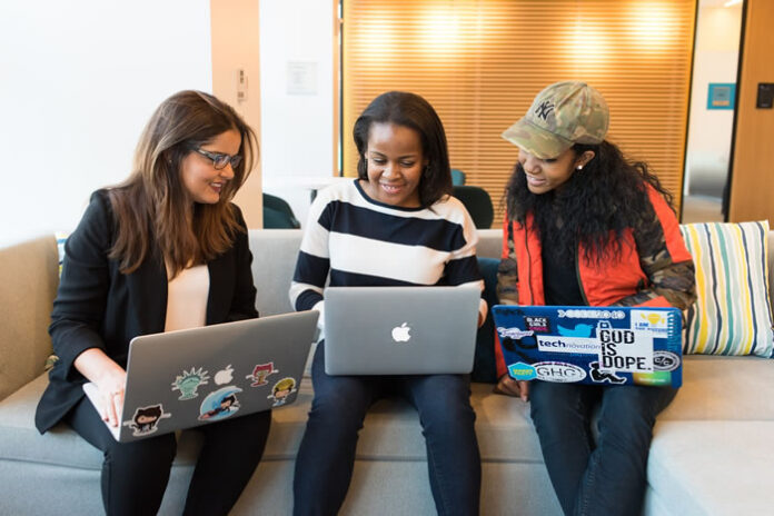 three girls in tech, diversity and inclusion with their laptops