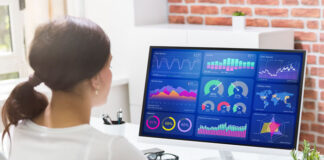 How Non-profit Organizations Can Benefit from Data Science girl working at desk looking at cloud SaaS dashboards showing how you can benefit from data science