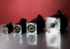 four stepper motors of varying sizes lined up in a row