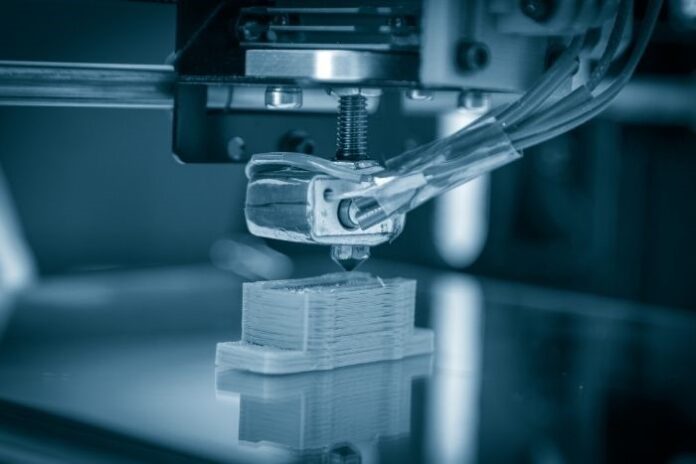 3D printer in action printing a piece of space material