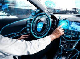 man in autonomous vehicle and pressing a button on a digital screen