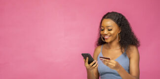 Avoiding the Price of Poor Payments: Customer Satisfaction and Safety smiling woman using her mobile phone for ecommerce online