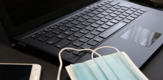 5 Simple Steps to Return to Tech, Get Ahead and Stand Out After COVID covid masks laying on a tech laptop keyboard