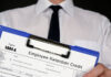 Why the Employee Retention Credit Represents the Best in Capitalism man holding a federal form 5884-A employee retention credit for the best in capitalism