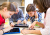 children in school learning with AI and technology