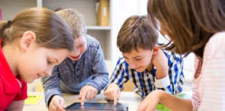 children in school learning with AI and technology