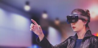 The Parts of an Augmented Reality System woman wearing virtual and augmented goggles to improve lives