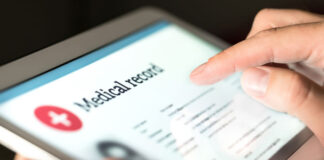 Moving Toward a More Perfect Union of Patient Data Collection medical provider looking at patient data on a tablet