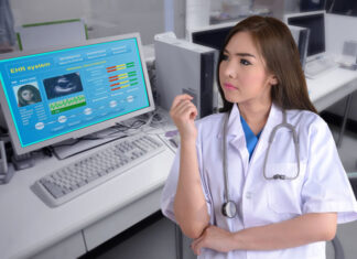 Five Instances When Anesthesia Record Software is a Need, Not a Want female medical provider looking at electronic health system