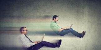 SEO and Page Speed in 2021: What’s Changing and How to Take Advantage two floating men on laptops sitting like they are in race cars testing their website SEO and page speed