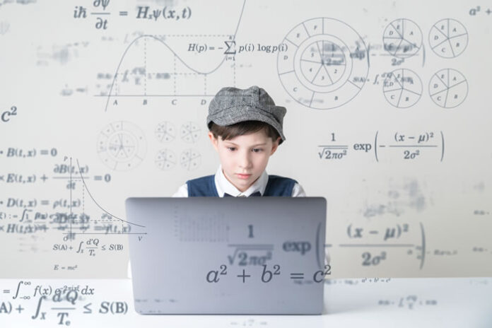 intent boy learning on laptop in ed tech