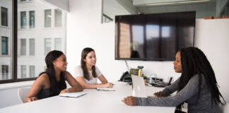 Machine Learning is Changing the Landscape of DEI Recruitment three diverse women interviewing for DEI recruitment