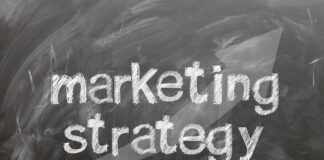 words marketing strategy written on a chalk board