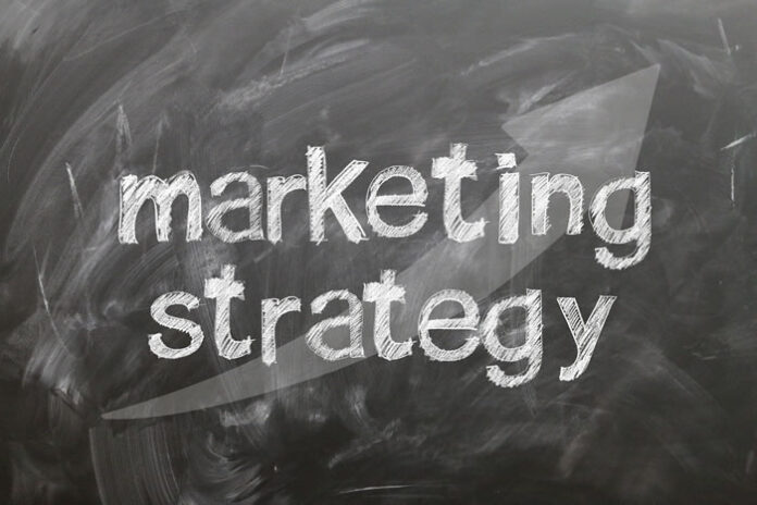 words marketing strategy written on a chalk board