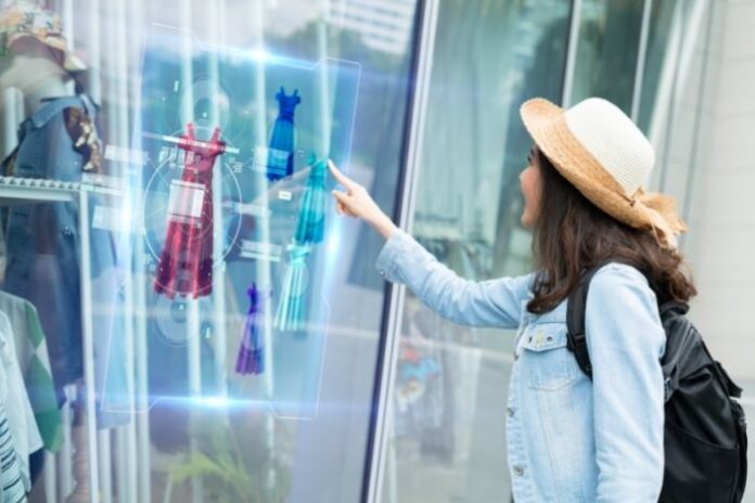 girl using virtual digital display to pick her fashion clothing