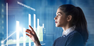 What Is Data Observability – And What Does It Look Like? woman interacting with digital data observability dashboard