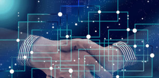 Benefits of Data Management in Large Retail Companies two businessmen handshake behind a digital data map