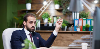 How Working in Different Fields Leads to Entrepreneurial Success successful business entrepreneur sitting at desk working