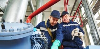 Common Applications for Industrial Generators two men inspecting an industrial generator
