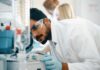 Mistakes People Make When Choosing Lab Equipment lab technician looking a lab equipment in a laboratory