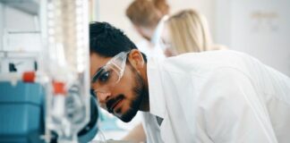 Mistakes People Make When Choosing Lab Equipment lab technician looking a lab equipment in a laboratory