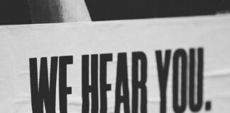 Create a Great Customer Experience by Improved Employee Experience sign that says we hear you - the customer experience