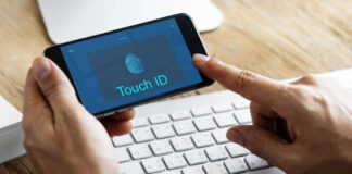 World Without Physical IDs: Enabling Frictionless Customer Experiences man with phone and having a frictionless customer experience