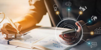 Is It About Time to Upgrade Your Treasury Management Systems? businessman working with treasury management system on phone