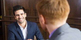 Four Questions to Avoid Rooking Mistakes in Selling a Business businessmen shaking hands and selling a business