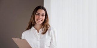 Outsourcing: 9 Myths Exposed smiling business woman working in talent outsourcing