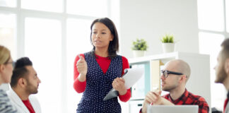 Successful Business Coach Experts and Why You Need Them business coach speaking to a group of business people