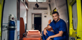 5 Important Principles All EMS Personnel Follow smiling EMS personnel sitting in medical ambulance