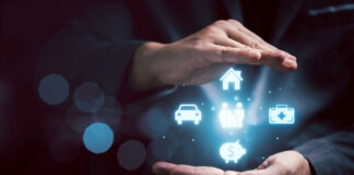 How “Big Guy/Little Guy” Collaboration Can Help Insurance Soar man holding a digital representation of insurtech or insurance