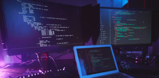 IT Teams Need to Stop Writing So Much Code programmers screens writing so much code